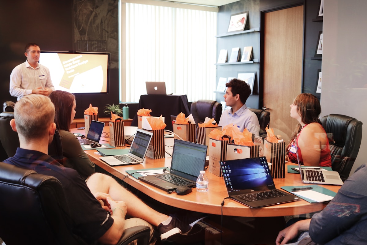 Owner reviewing business operations with team member